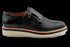 Zapatillas de vestir con doble hebilla y diseño perforado en negro